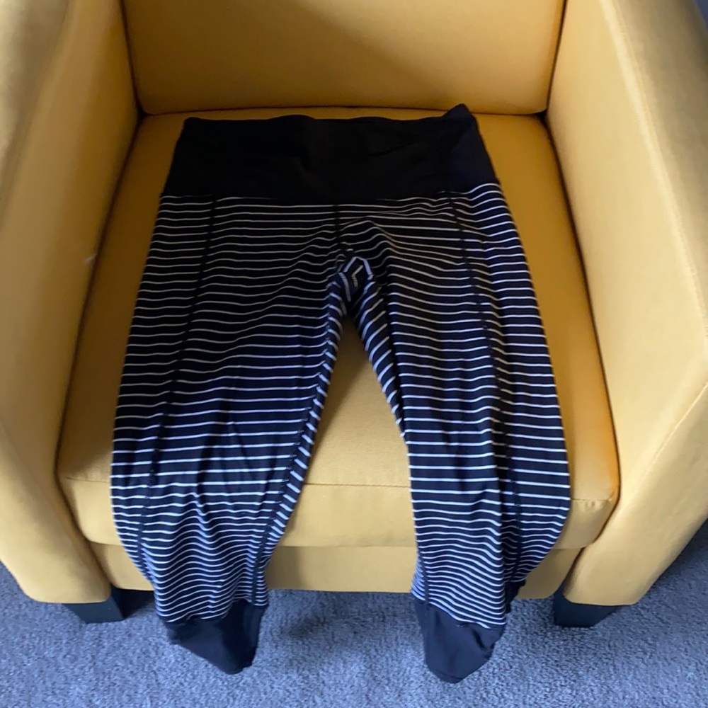 Lululemon stripped leggings with ankle zipper. Size 6